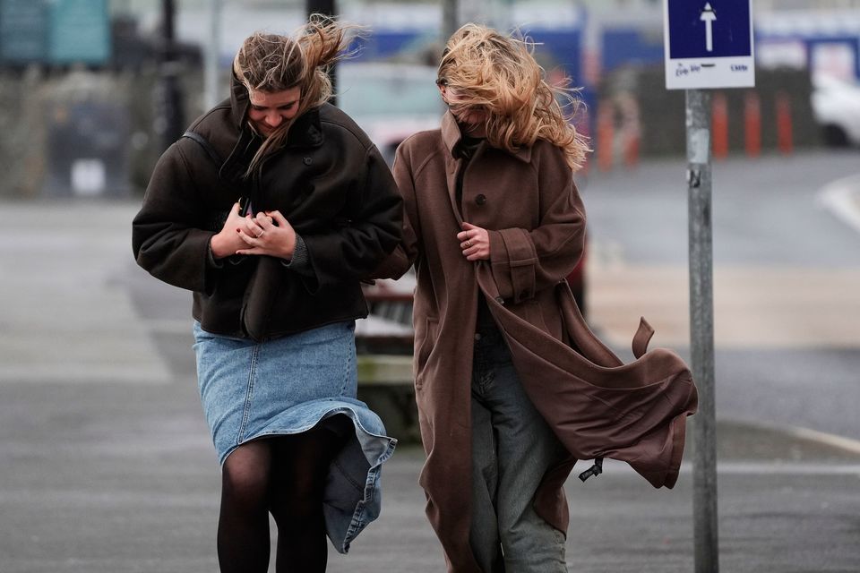 People struggle to walk in the wind on the promenade in Salthill, Galway. Stock photo: Brian Lawless/PA Wire
